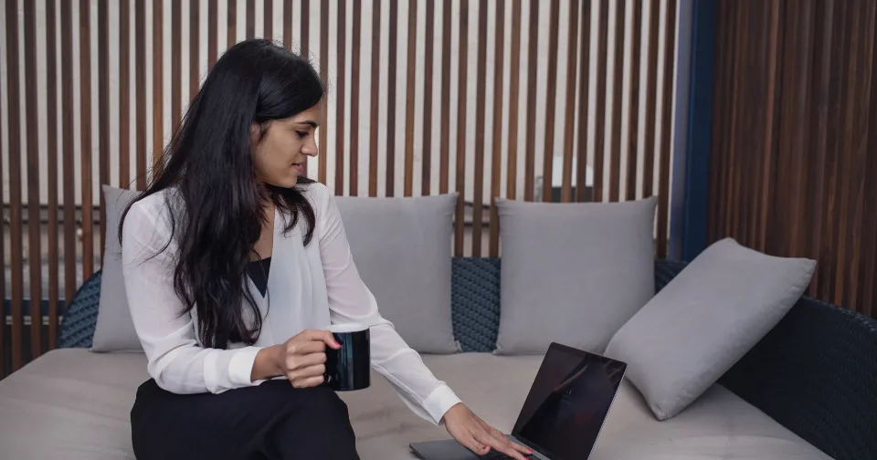 Someone working through email on a laptop