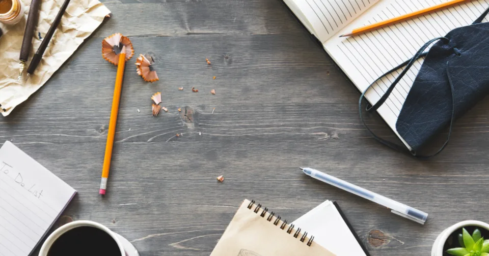 Paperwork and a pen on a writing desk